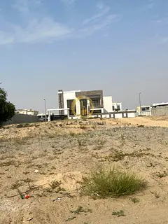 Land for sale in Sharjah Al-Houshi area, Al-Badiya suburb Area: 6,100 sq ft