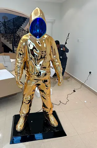 Large Gold Astronaut Statue with Blue Visor - Decorative Sculpture