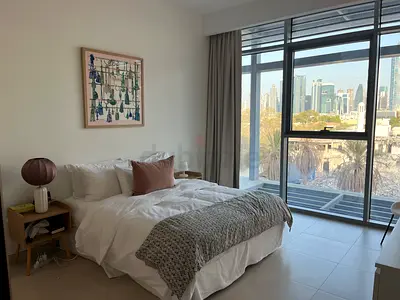 Queen bed with bedside tables and linens — furnished bedroom set