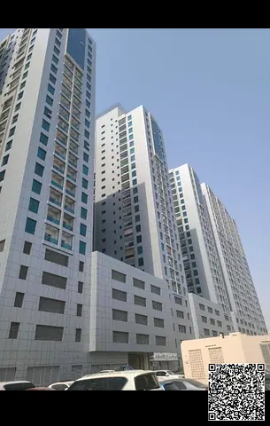 Apartment for Sale in Ajman City Tower A two-bedroom apartment with a spacious living room, two bathrooms, and a balcony featuring an open and beaut