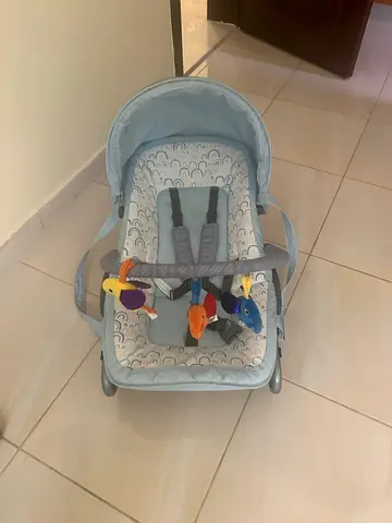 Light blue baby rocker/bouncer with toy bar - gently used