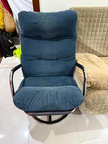 Blue padded lounge chair with chrome frame