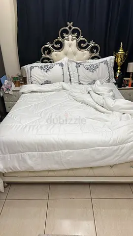Queen size upholstered bed frame with decorative headboard to be sold without the mattress
