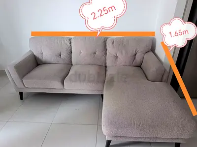 Tan L- shaped sofa