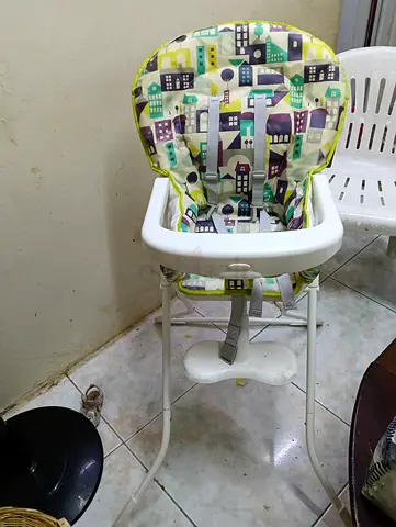 Used baby high chair with removable tray and harness