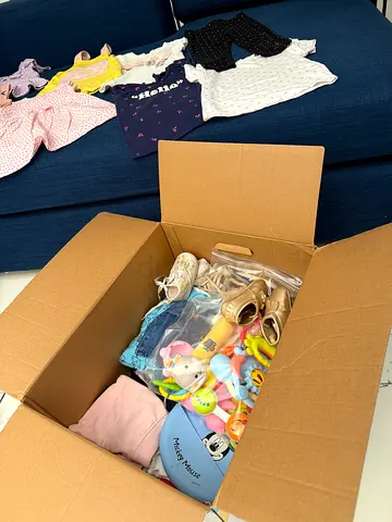 Box of baby girl clothes, shoes and mixed toys - good condition