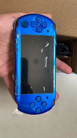 Blue Sony PSP 3000 handheld console - new with pre installed games like fifa gta and wwe etc.