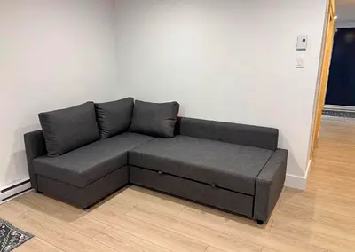 Grey L-shaped Sofa Bed with Storage - Good Condition