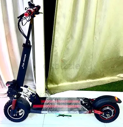Used Winor electric scooter - dual suspension, foldable, good condition