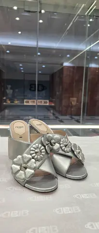 Silver floral block-heel women's sandals, size unknown, gently used