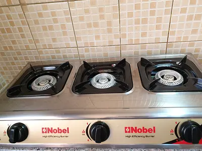 Both in 120 AED. Nobel 3-Burner Stainless Steel Gas Stove - with cabinet for sale