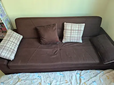 Brown 3-seater fabric sofa bed in good condition