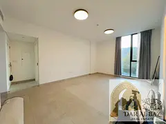 Two-bedroom apartment for annual rent in Al Jadah. 3 bathrooms, spacious American-style kitchen, ope