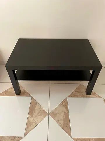 Simple black coffee table with lower shelf - good condition