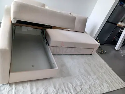 L-shaped beige fabric storage sofa - good condition