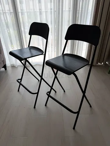 Two IKEA FRANKLIN Bar Chairs - dark wood finish (label shown)