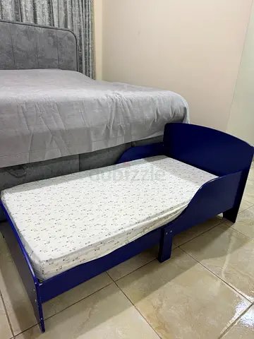 Blue toddler/child bed with mattress - good condition
