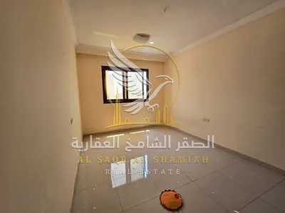 Two bedrooms and a living room for annual rent in Al Qulayaa Sharjah Spacious area balcony built-in wardrobes central air conditioning