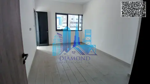 For annual rent: A two-bedroom apartment with a living room—first-time occupancy in a new building—located in Al Nuaimiya 1, Ajman.