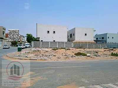 For sale: Residential/commercial land on a corner plot of two streets in Al Muwaihat 1 area, Ajman. Land area: 11,810 sq ft