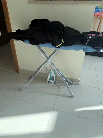 Used ironing board with iron included - good condition