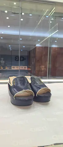 Prada navy slip-on mules, size visible on request — light wear