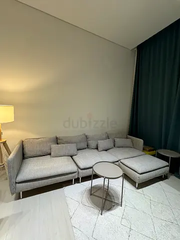 Light grey L-shaped fabric sofa approx. 291 × 151 cm, H 83 cm
