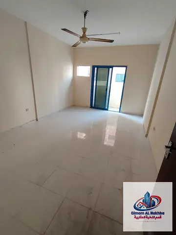 Large 2-bedroom apartment with 2 balconies, 2 bathrooms, spacious kitchen with cabinets and central gas, prime main-road location.