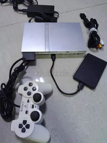 Playstation 3 slim with loaded ne controller+ 100 games loaded