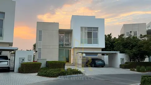 Villa for sale in Al Zorah area, Ajman, overlooking the golf courses, with a swimming pool and private elevator. Two floors and a roof terrace. Modern