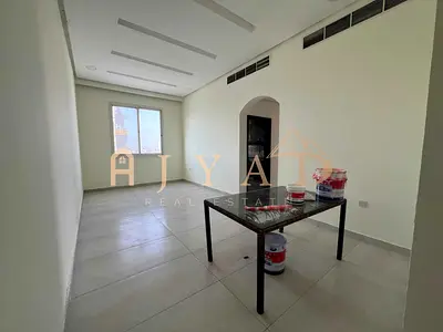Annual rent: 2BR + maid’s room in Al Rawda 3. 1 month free, central AC, 4 baths, easy payments, prime location near services.