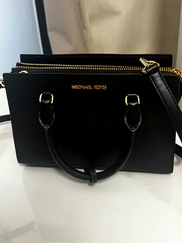 Black structured leather handbag with shoulder strap