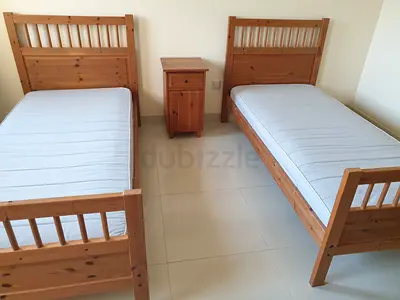 Great deal ! 2 single beds / bunk beds with mattresses + commode + night table for 700 AED only!