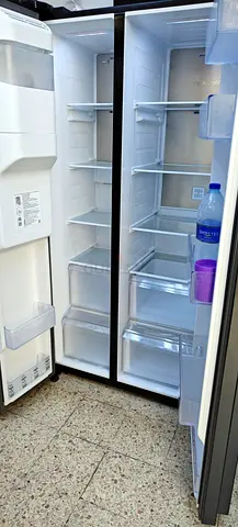 Samsung brand side by side fridge freezer with water dispenser and ice maker