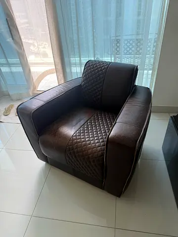 2 Brown leather single-seater armchair with quilted side panels