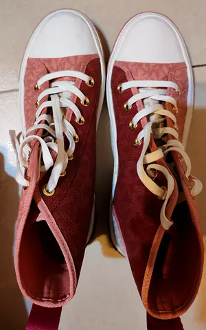 Pink high-top women's sneakers, lightly used