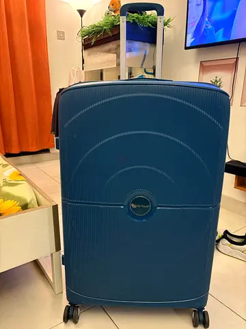 Blue hard-shell carry-on suitcase with spinner wheels (good condition)