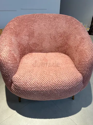 Comfortable pink boucle accent armchair with cushion