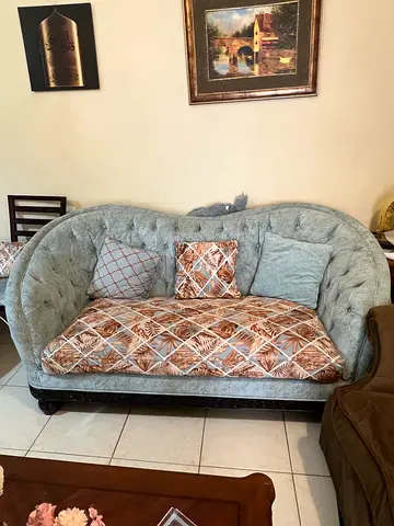 Light blue tufted 7-seater sofa with cushions