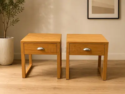 Pair of solid wood bedside tables / nightstands in light oak