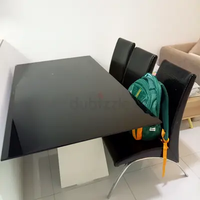 Large Glass-top Dining table with 3 black and 3 white cushion chairs + 2 free long window curtains