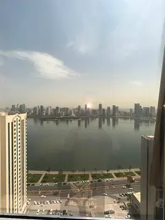 Two-bedroom apartment with a living room and sea view in Al Majaz 3, featuring a gym, swimming pool,