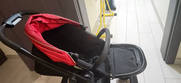 Used stroller/pram in good condition - red canopy