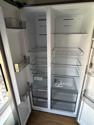 Large Side-by-Side Hisense Refrigerator — less than 12 months old, like new.