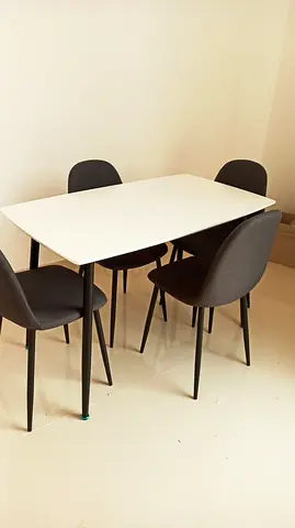 White rectangular dining table with 4 black chairs - good condition