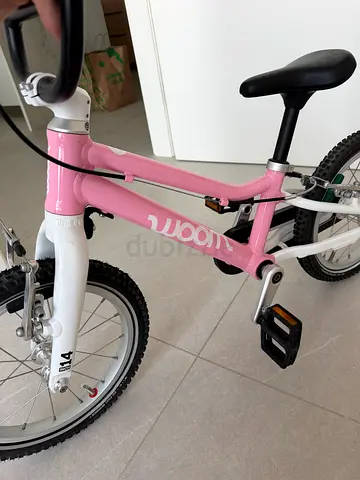 Pink 14-inch Woom kids bicycle - new condition