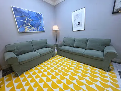 Set of 2 green 3-seater sofas with removable covers