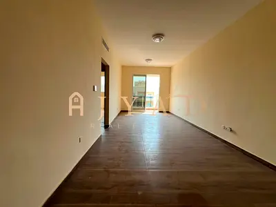 1BR in Al Muwaihat 3, Ajman. Brand new, first tenant, 1 month free, built-in wardrobes, central AC, balcony, easy payments.
