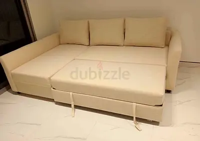 Beige L-shaped Sofa Bed with Storage - Good Condition