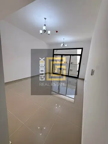 Spacious Two-Bedroom Apartment with Large Living Room for Annual Rent in Al Jurf 3